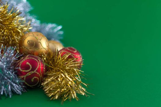 Christmas decoration, red gold and silver, on green background