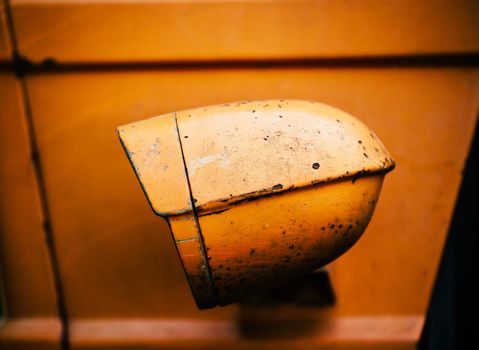 Closeup on a vintage tractor headlamp. Film emulation filter applied.