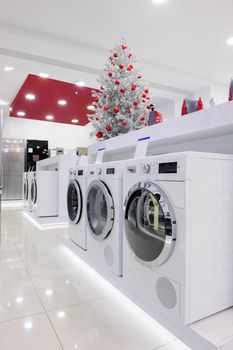 Washing machines, refrigerators and other home appliance in retail store at Christmas sales