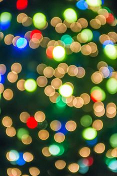 defocused christmas tree lights in a city background