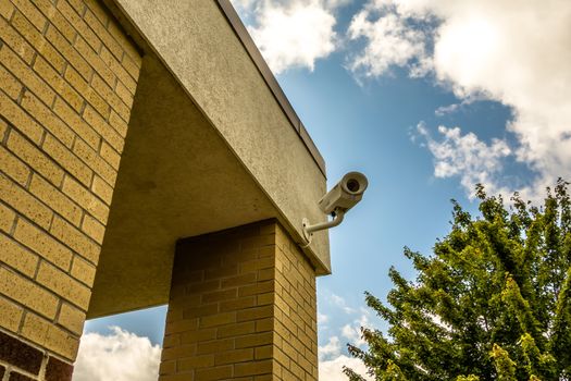 Three security cameras attached on the office building corner