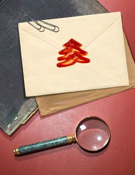 Christmas message with wax seal and other documentation on retro background