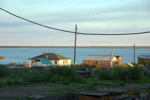Houses of Chersky town at Kolyma river coast, Yakutia, Russia