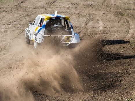 Car during a "stock car cross" race. The league called "stock car cross" foresees the use of tuned cars on unpaved circuits.