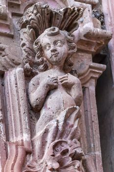 Stone Angel Templo de San Francisco Facade Church San Miguel de Allende, Mexico. San Francisco Church was created in 1778.  The facade is Churrigueresque, Spanish baroque, style with stone statues.

