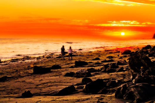 walking on the beach with summer sunset