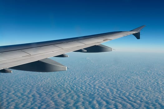 Airplane flying above clouds great travel transportation background image