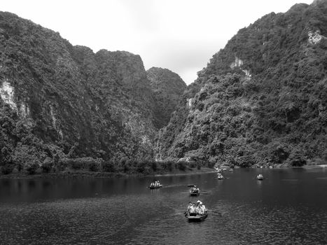 NINH BINH, VIETNAM, JULY, 20: Unidentified tourists in Trang An  on JULY, 20, 2013. Trang An is the scenic area, ranked special of Vietnam.