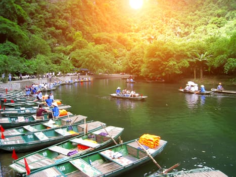 NINH BINH, VIETNAM, JULY, 20: Unidentified tourists in Trang An  on JULY, 20, 2013. Trang An is the scenic area, ranked special of Vietnam.