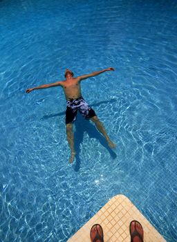 Man enjoying summer in the pool