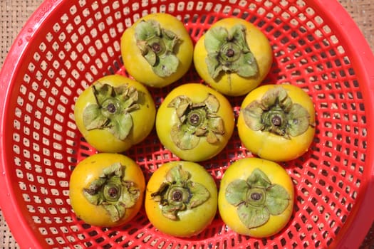 The persimmons in the basket