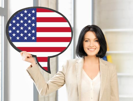 education, foreign language, english, people and communication concept - smiling woman holding text bubble of american flag