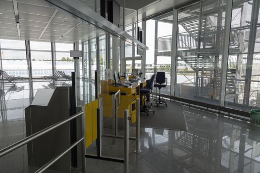 A desk for persons working with boarding at an airport