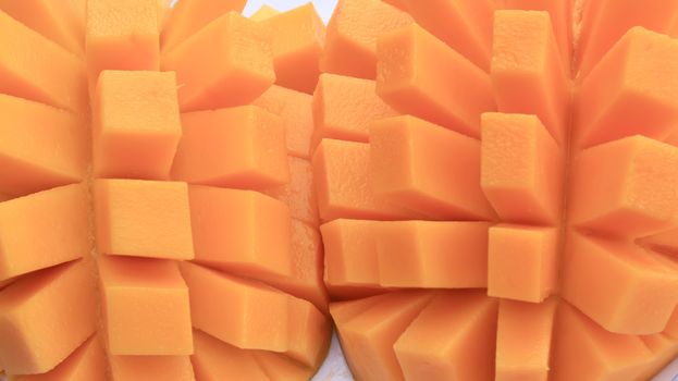 Mango slice cut to cubes close-up