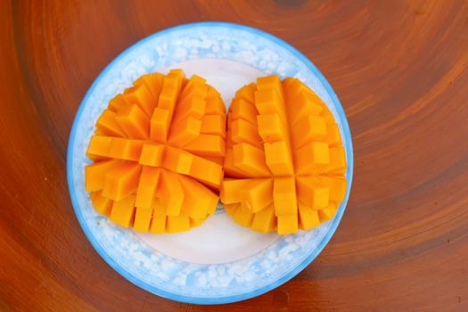 Mango slice cut to cubes close-up