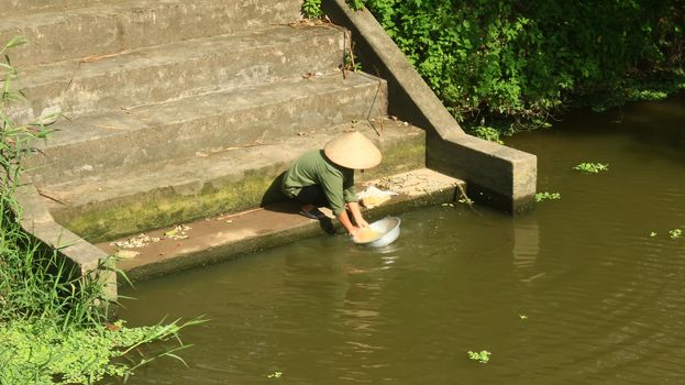 women washing clothes in the river