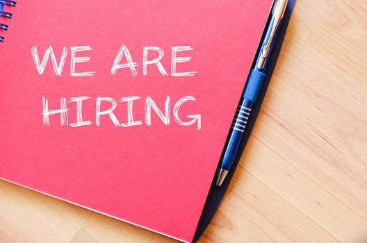 We are hiring text concept write on notebook