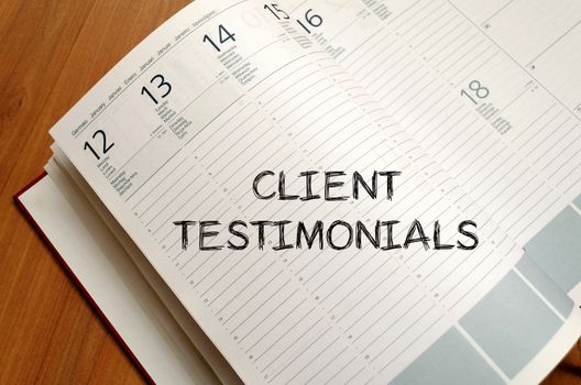 Client testimonials text concept write on notebook