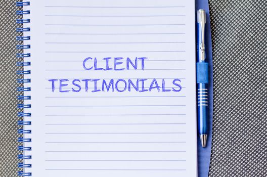 Client testimonials text concept write on notebook with pen