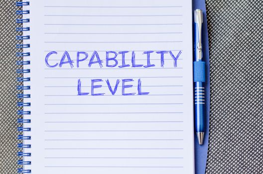 Capability level text concept write on notebook with pen
