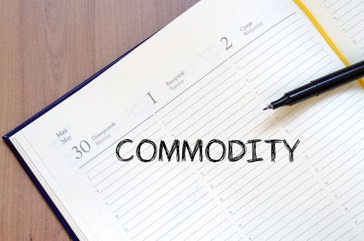 Commodity text concept write on notebook with pen