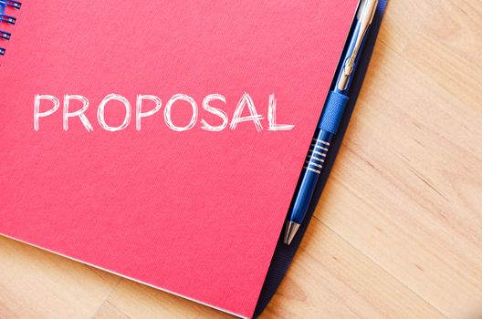 Proposal text concept write on notebook with pen