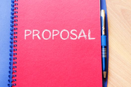 Proposal text concept write on notebook with pen