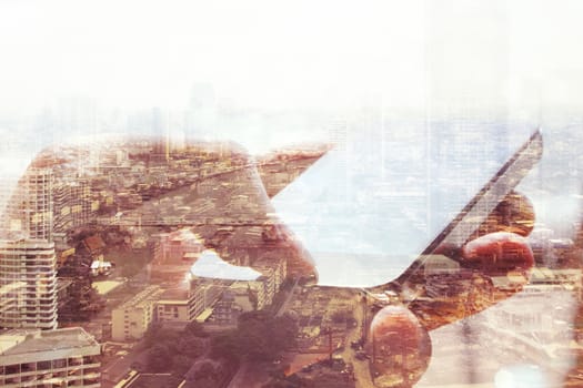 Double exposure of cityscape and smart phone, business technology concept.