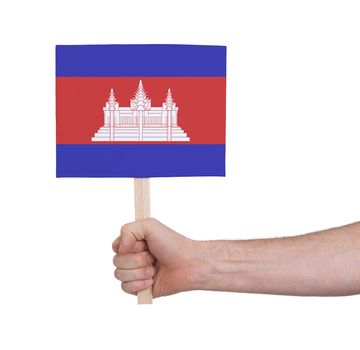 Hand holding small card, isolated on white - Flag of Cambodia