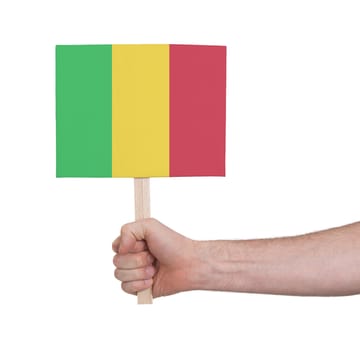 Hand holding small card, isolated on white - Flag of Mali