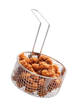 close up of popcorn chicken basket isolated