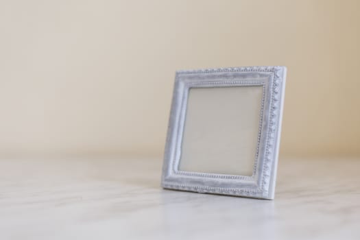 Close up detailed front view of white blank wooden frame with copy space.
