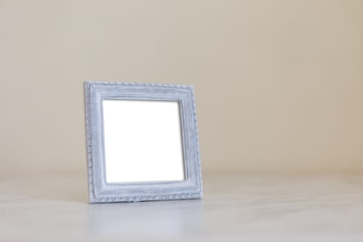 Close up detailed front view of white blank wooden frame with copy space.