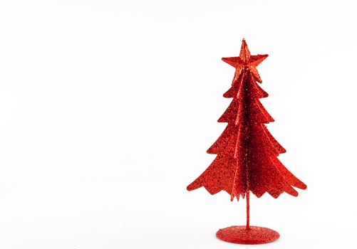 Little, red metallic christmas tree on white background