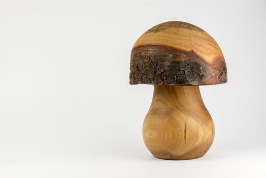 Wooden mushroom carved out trunk of a birch as decorative background
