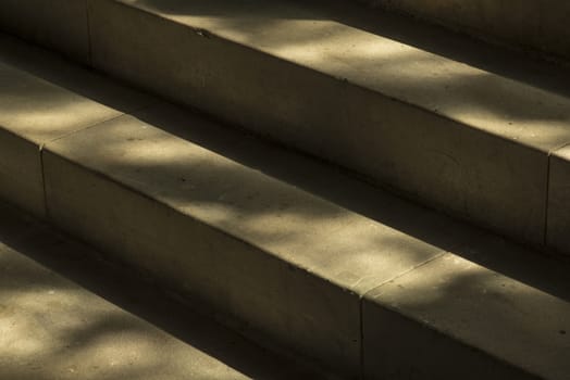 Natural stone staircase in soft morning light in a historic building
