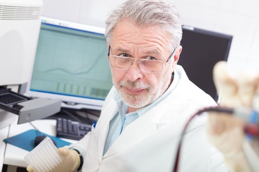 Life science researcher  performing a genotyping testing which enables personalized medicine. PM is a medical model that proposes the customization of healthcare.