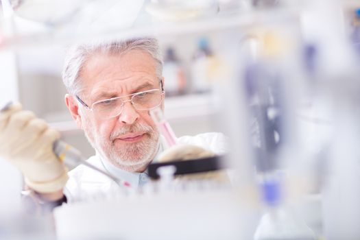 Life scientist researching in laboratory. Life sciences study living organisms on the level of microorganisms, viruses, human, animal and plant cells, genes, DNA...