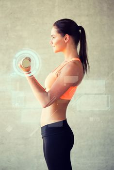 fitness, sport, training, future technology and lifestyle concept - smiling woman with dumbbells in gym and projections