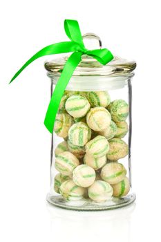 Photograph of a beautiful jar full of colorful candies, on a white background