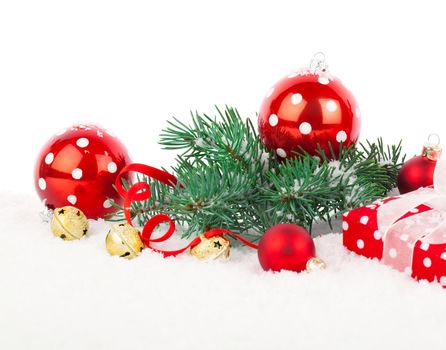 Christmas balls and fir branches with decorations isolated over white