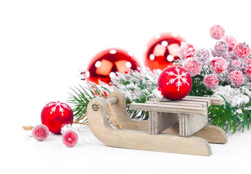 Christmas balls and fir branches with decorations isolated over white