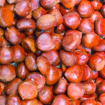 Pile of chestnuts. Autumn background.