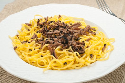 Pasta typical of Piedmont called tajarin with truffle, italy