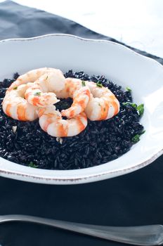 Black rice with prawns fresh, italy