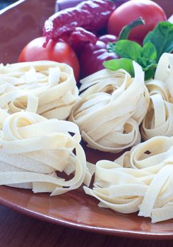 Typical Italian pasta called " noodles " with hot peppers and tomatoes, italy