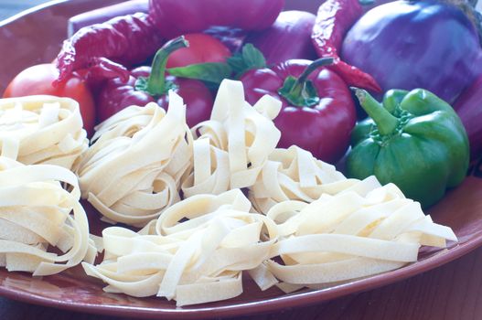 Typical Italian pasta called " noodles " with hot peppers and tomatoes, italy