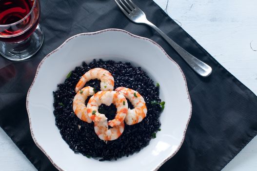 Black rice with prawns fresh, italy