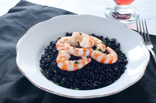 Black rice with prawns fresh, italy