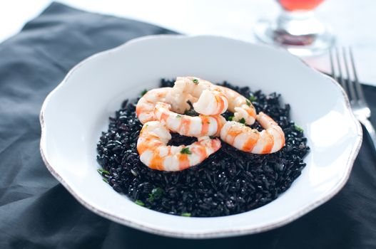 Black rice with prawns fresh, italy